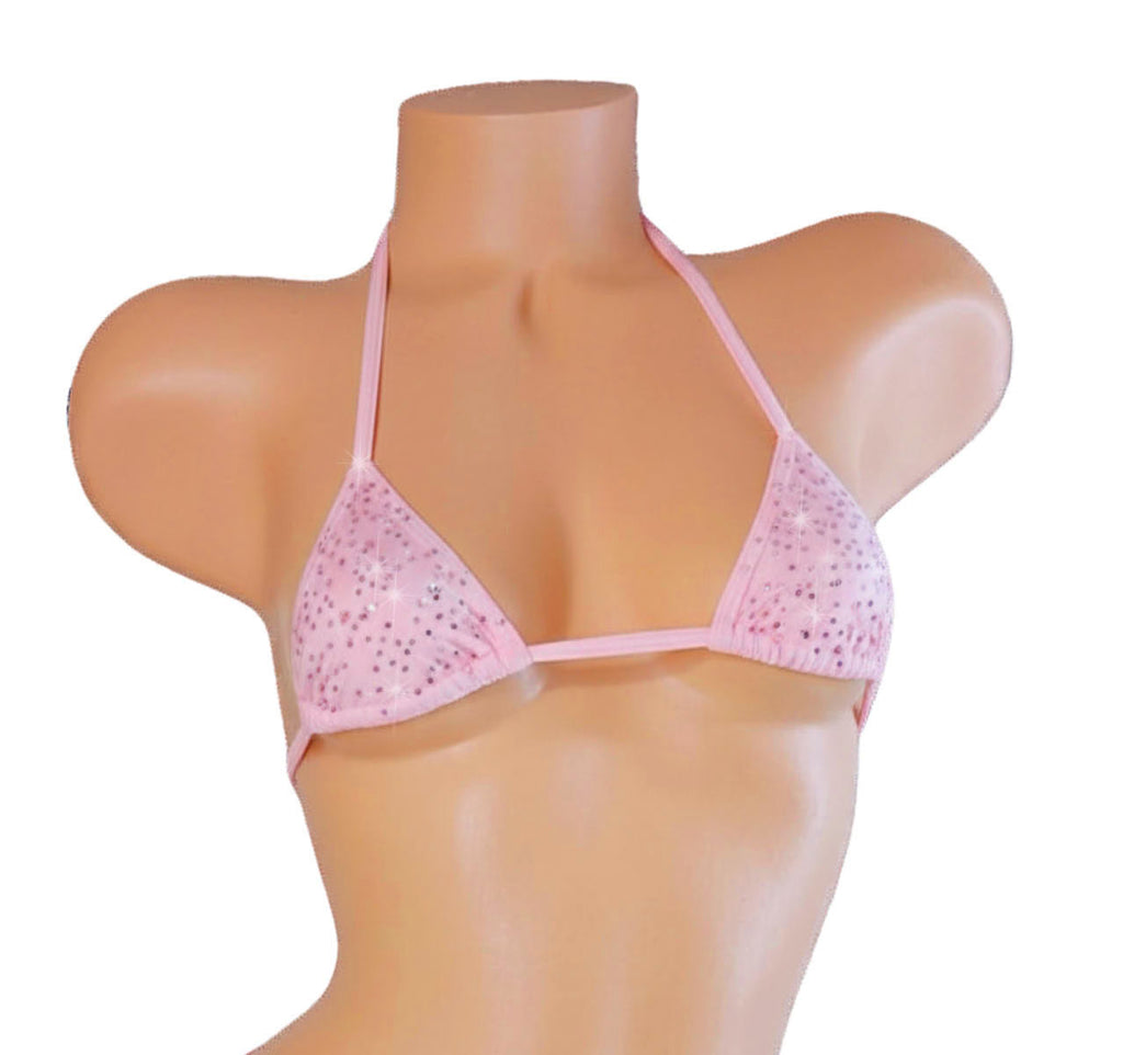 Pink bikini top on a mannequin with a white background