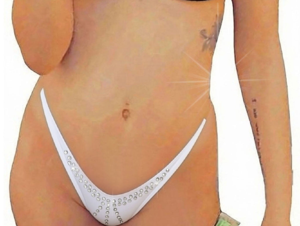 A model wearing a  sparkling rhinestone minimal coverage micro tiny bikini bottom with clear elastic straps against a white background.