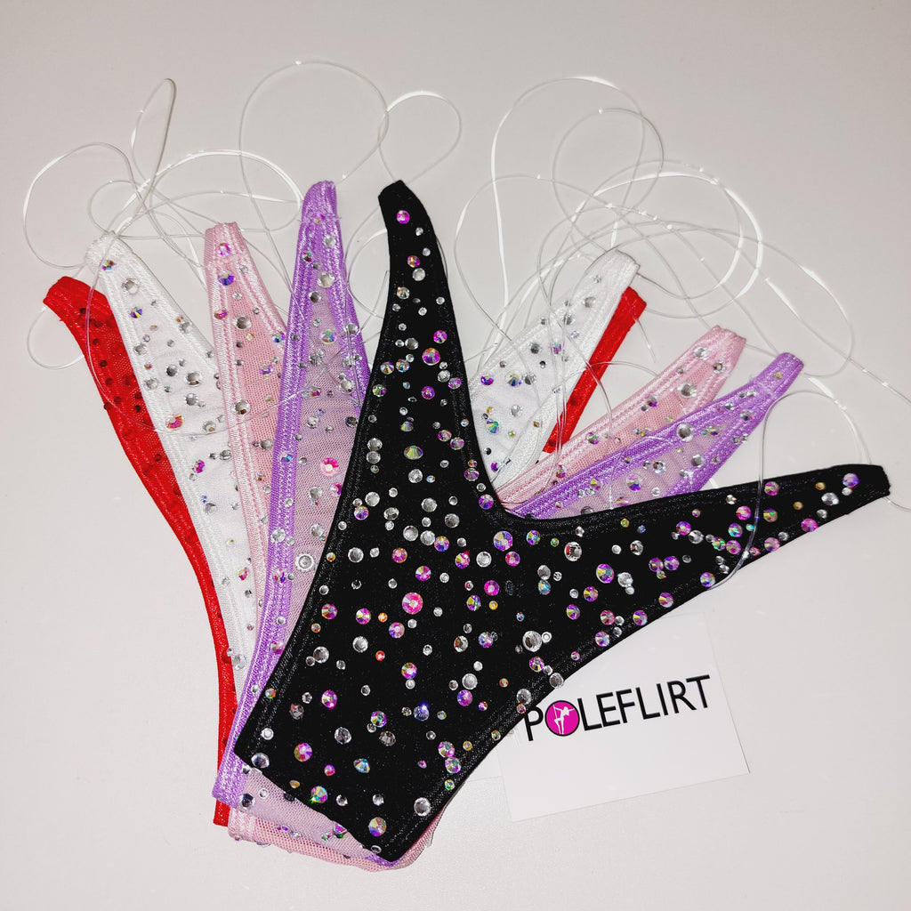Product shot of 5 colorful thong bikinis wiht clear elastic straps that look invisible with the brand name of POLEFLIRT on the tag.