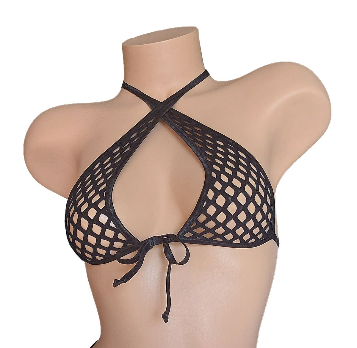 Black fishnet bikini on a plastic beige mannequin torso against a white background