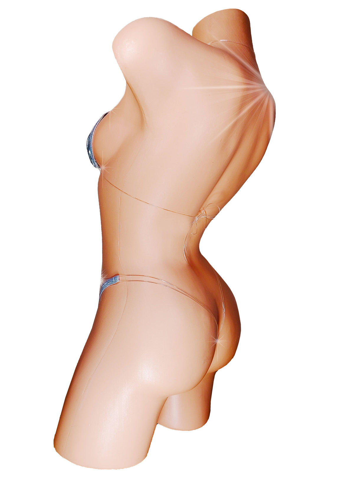 A female torso mannequin shown in side profile against a plain white background, wearing a very minimal silver strap bikini with clear straps that appear invisible.