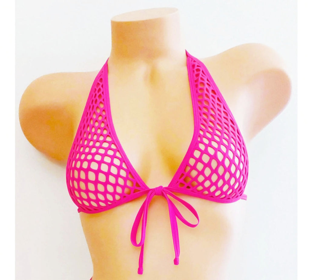 Hot Pink fishnet tie haltr top on a plastic beige mannequin against a plain background.