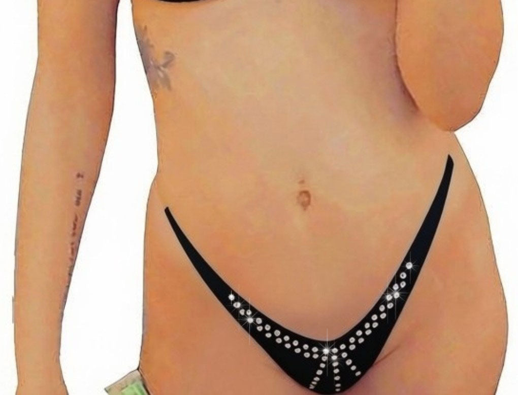 A model wearing a minimal coverage micro bikini bottom with clear elastic straps on the side adorned with a sparkling crystal rhinestone design.