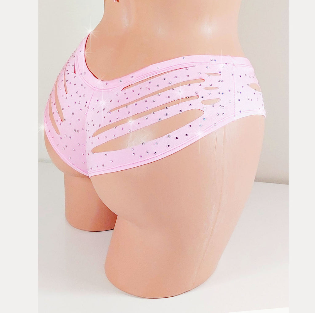 Mannequin wearing pink boyshorts with cut-out design and scattered rhinestones all over on a plain background