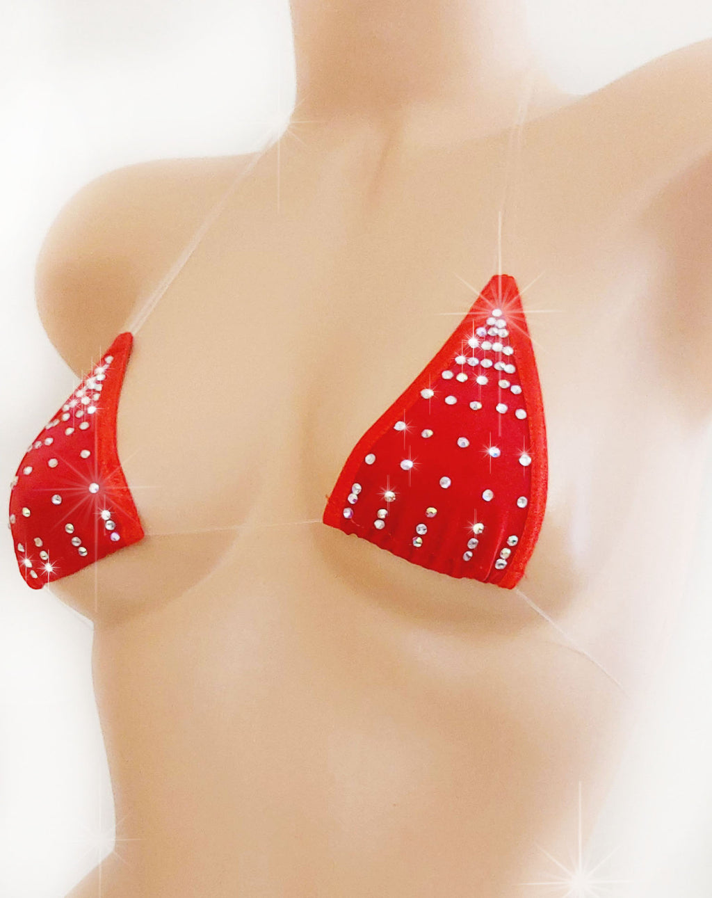 Red triangle bikini top with rhinestone design on a plastic beige female torso mannequin against a plain background.