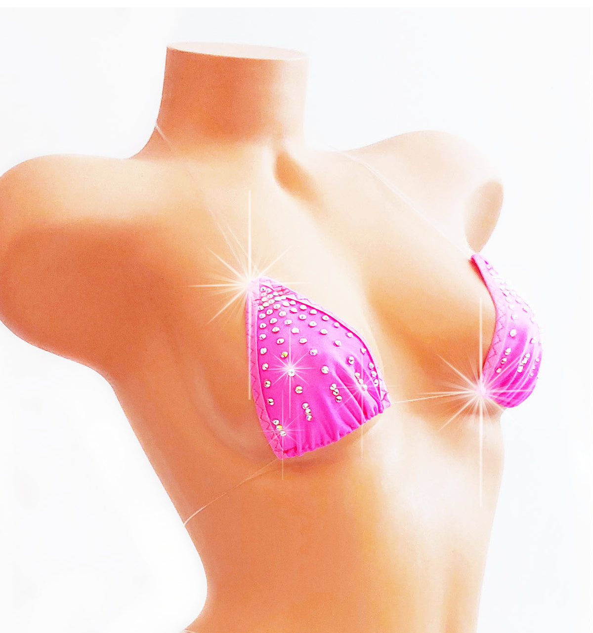Hot Pink bikini top with clear strings that look invisible, adorned with rhinestones, on a plastic beige female mannequin torso.