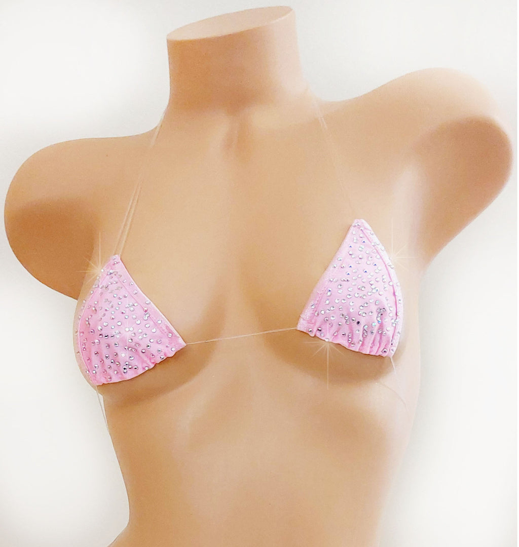 A pink triangle bikini top with rhinestone embellishments, displayed on a beige mannequin torso against a plain white background.