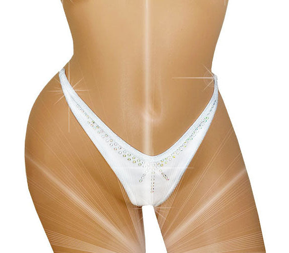 White thong-style underwear with rhinestone embellishments along the front waistband, displayed on a tan mannequin torso against a white background with decorative light streaks.