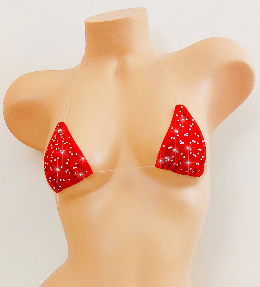 Red bikini top scattered with rhinestones with clear invisible straps on a mannequin.