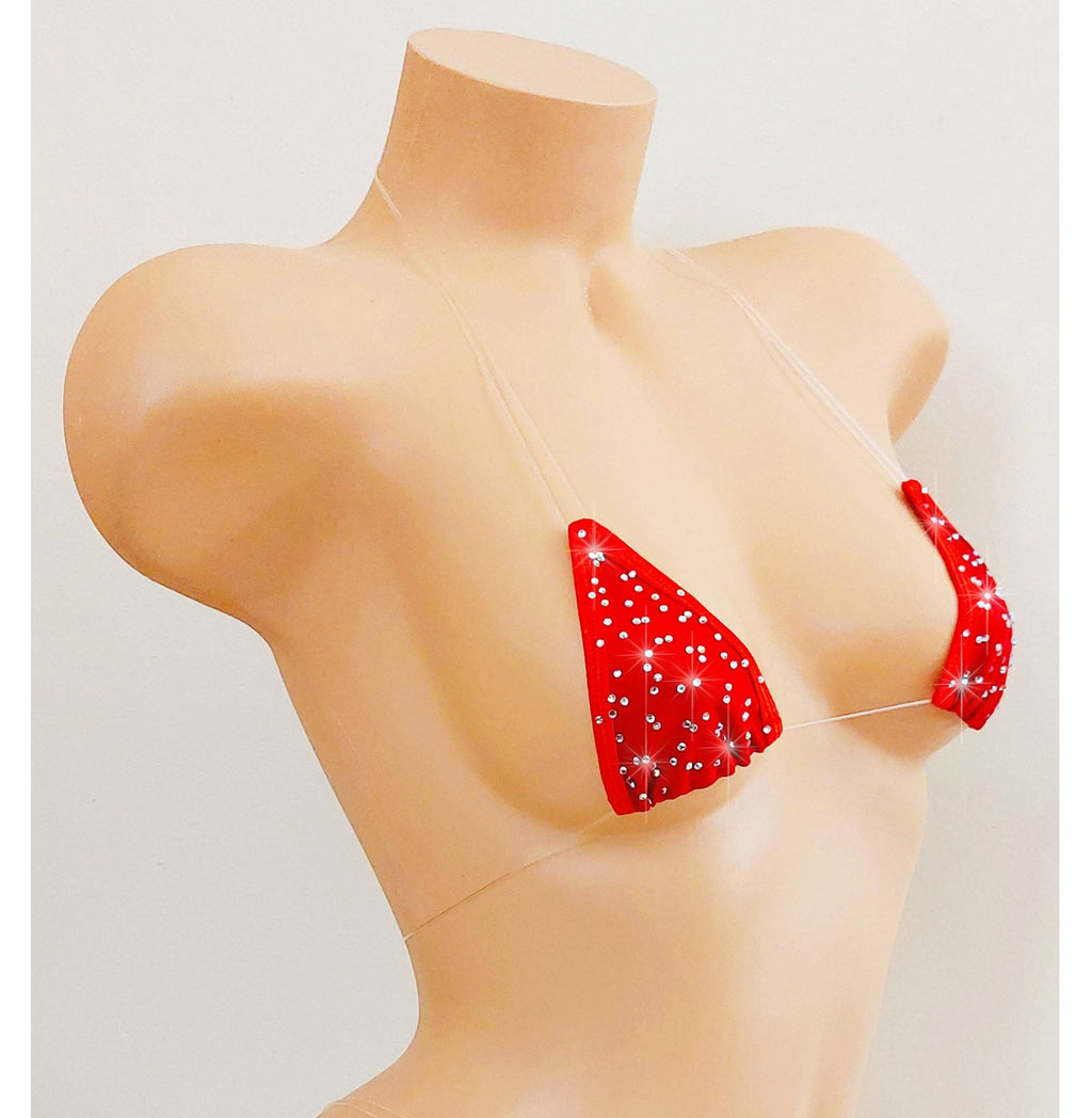 Red bikini top scattered with rhinestones with clear invisible straps on a mannequin.