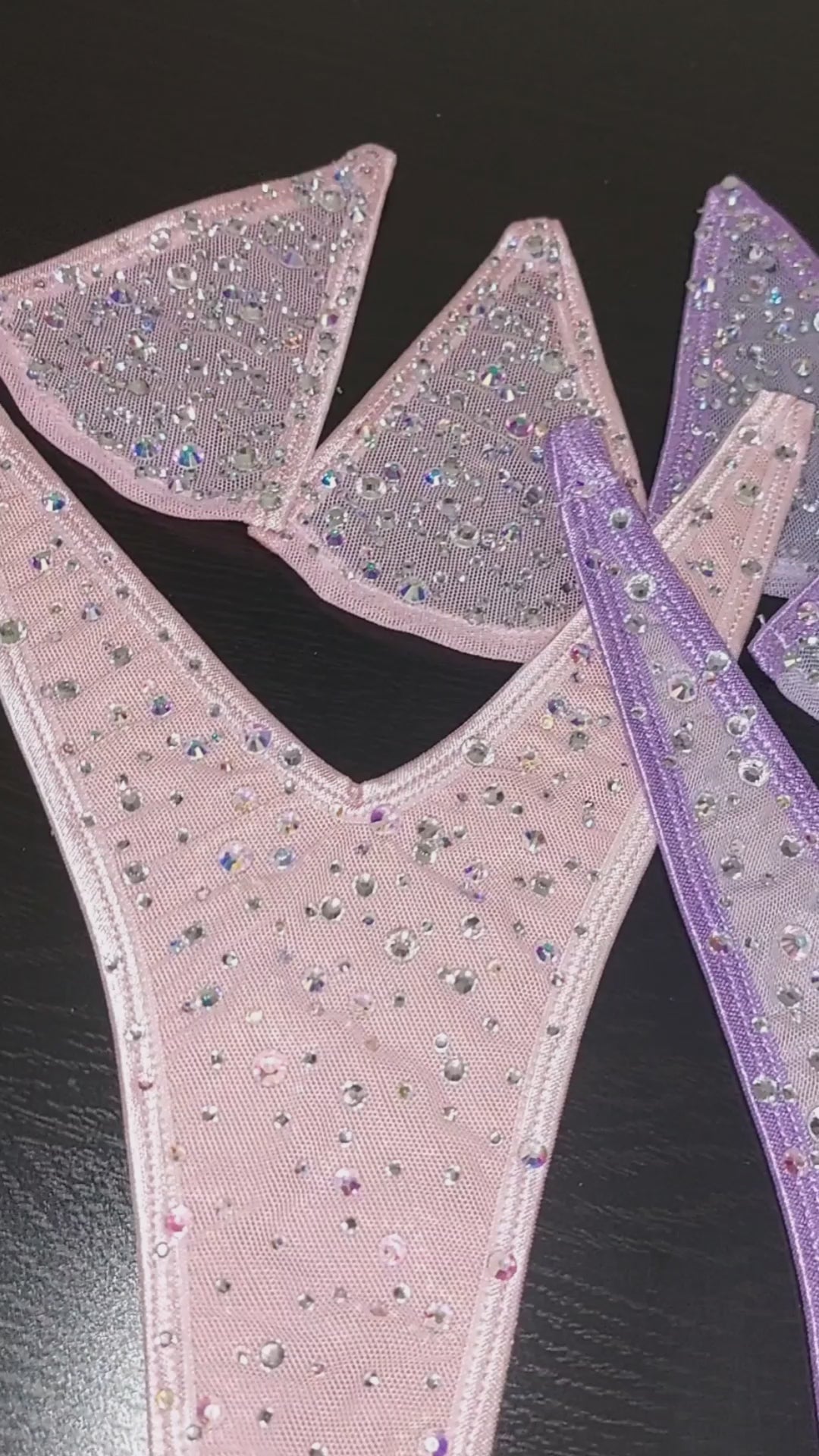 VIDEO of five different colored sparkling rhinetone minimal coverage bikini with clear elastic straps that appear invisible.