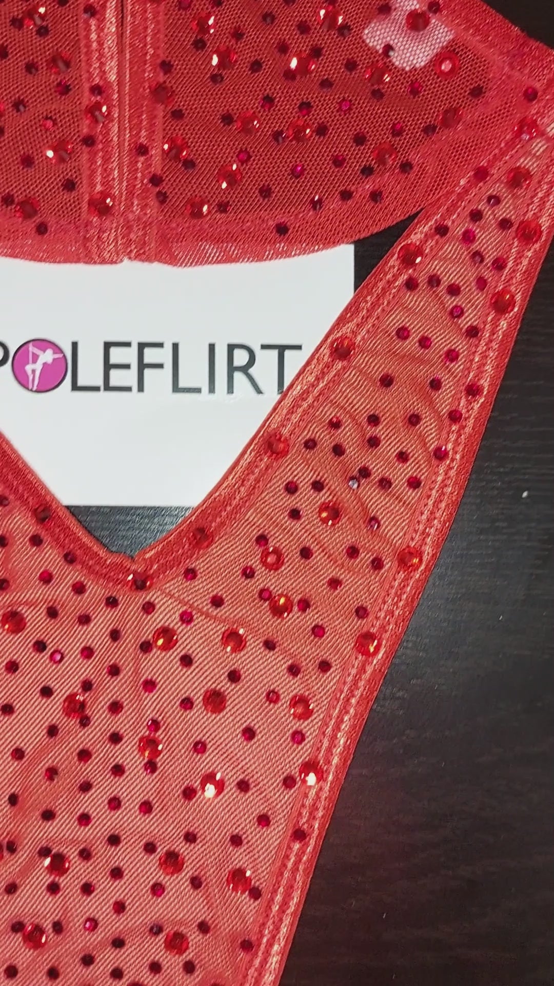 VIDEO of a product shot and then a beige plastic mannequin displaying a red sparkling rhinetone minimal coverage bikini with clear elastic straps that appear invisible.