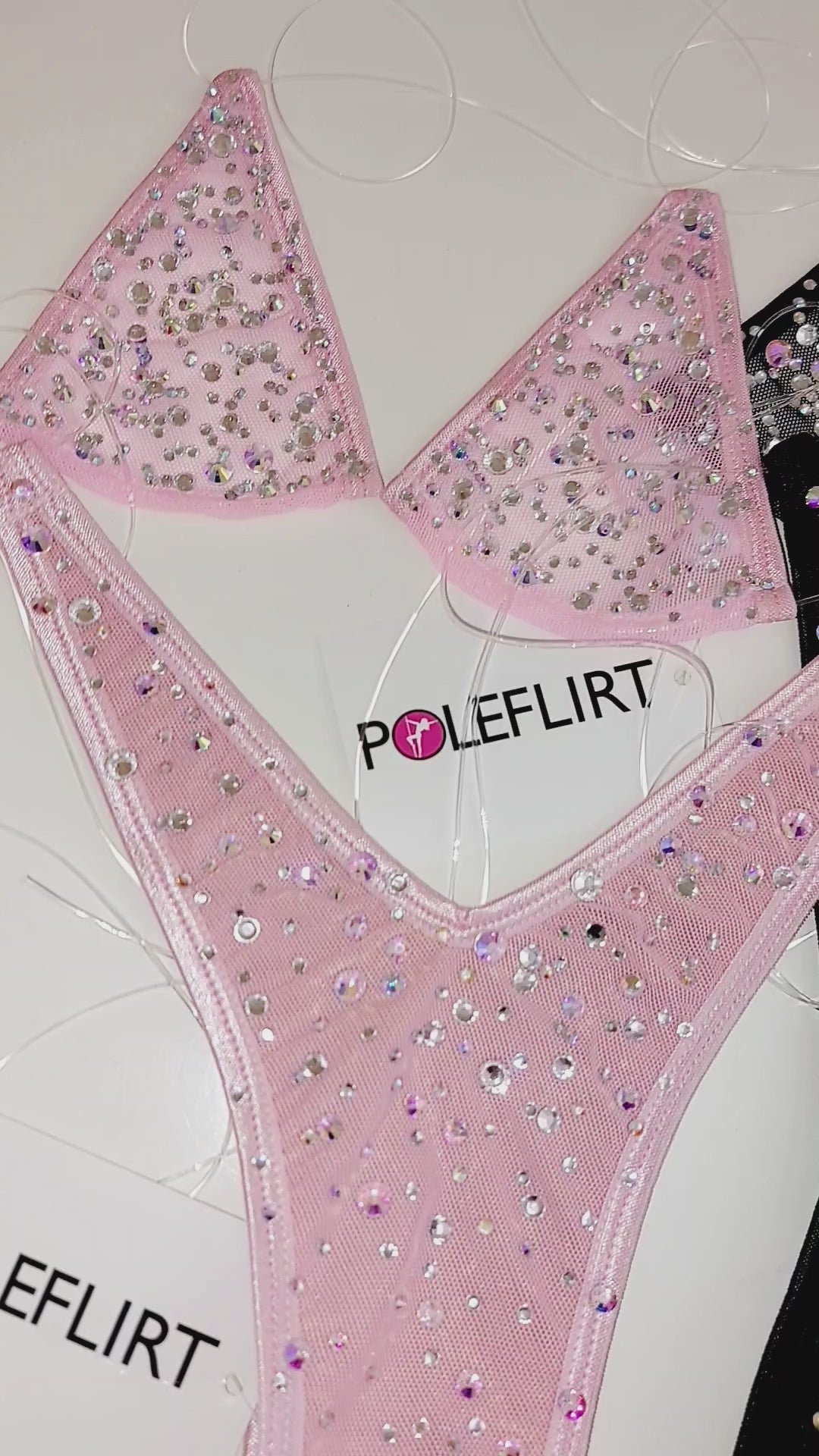 VIDEO of five colorful rhinestone mesh bikini sets with a hang tag of brand name POLEFLIRT attached.